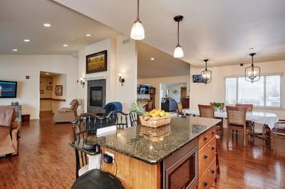 Bright common area with seating and a kitchen island