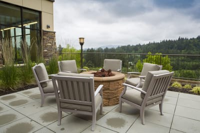 Outdoor fire pit area with seating and scenic view
