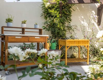 Outdoor gardening space with pots and gardening tools