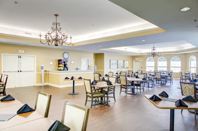 Bright dining room with tables set for meals
