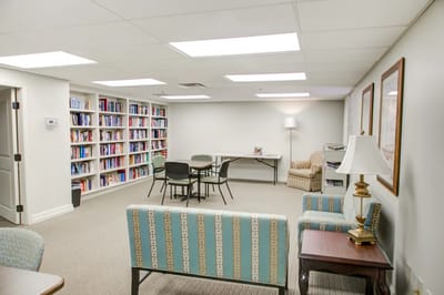 Common area with bookshelves and seating