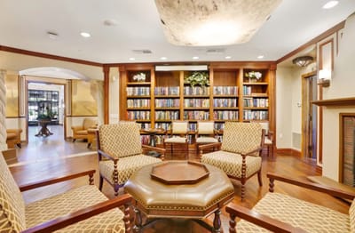 Interior view of a cozy library area with seating