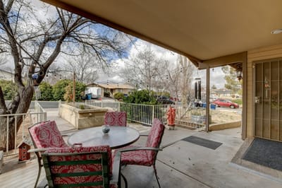 Outdoor seating area with a table and chairs