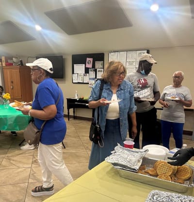 Residents enjoying a meal together in a common area