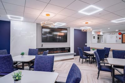Interior view of a bright common area with seating