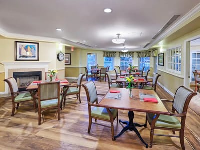 Bright dining room setup with tables and chairs