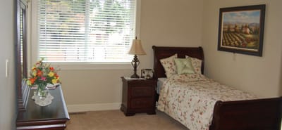 Cozy private resident room with a bed and window