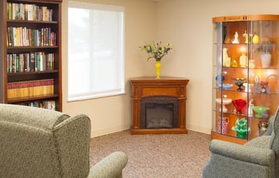 Cozy common area with bookshelves and decorative display