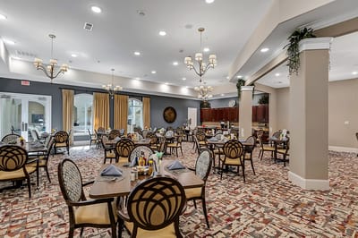 Spacious dining room with elegant decor and table settings