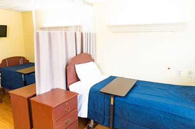Private resident room with a single bed and furniture