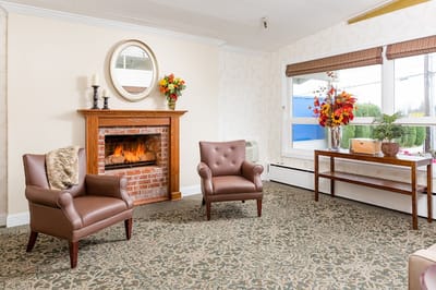 Cozy lounge area with comfortable chairs and a fireplace