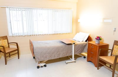 Comfortable resident room with bed and seating