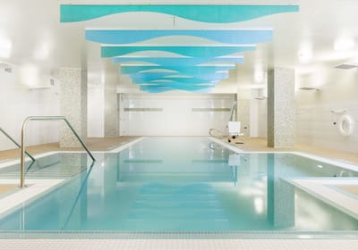 Indoor swimming pool with relaxing blue accents