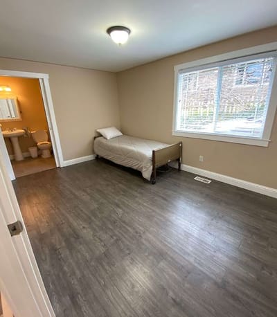 Private resident room with a bed and window