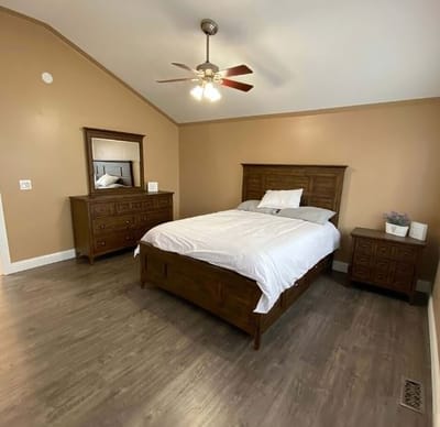 Bright, cozy resident room with wooden furniture