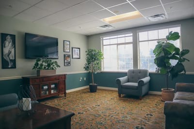 Cozy common area with comfortable seating and plants