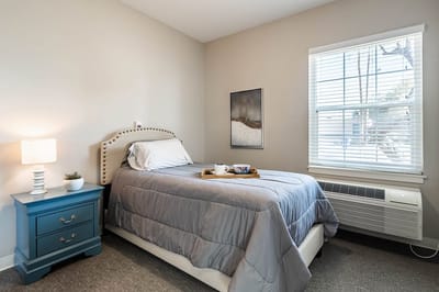 Cozy private resident room with a bed and decor