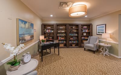 Cozy common area with bookshelves and comfortable seating