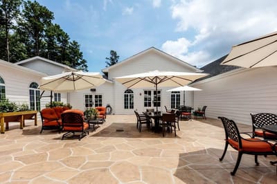 Outdoor patio area with seating and umbrellas