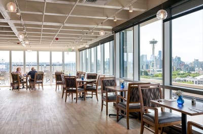 Dining area with tables and views of the city skyline