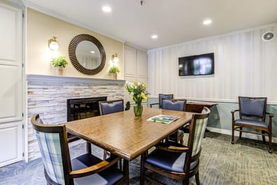 Common area with a table and chairs in a cozy setting