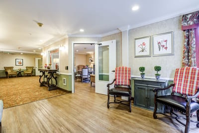Well-lit common area with seating and decor
