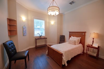 Cozy, well-furnished resident room with natural light