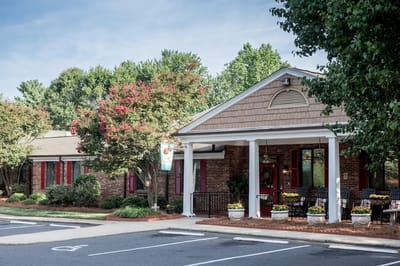 Exterior view of White Oak Manor Charlotte with landscaping