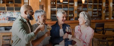 Residents enjoying drinks and celebrating in a common area