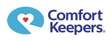 Comfort Keepers logo with heart and caregiving elements