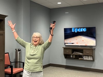 Resident celebrating during an activity in a common area