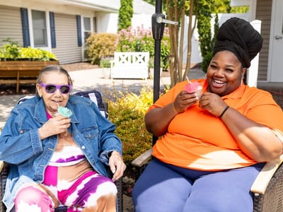 Residents enjoying ice cream in a garden