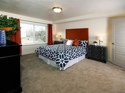 A well-furnished bedroom in a senior living facility