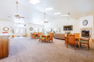 Bright common area with dining tables and seating