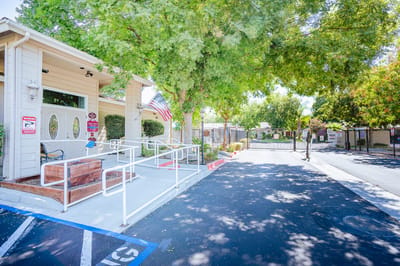 Front entrance of Claremont Senior Apartments with garden