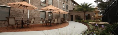 Outdoor seating area with umbrellas and fountain