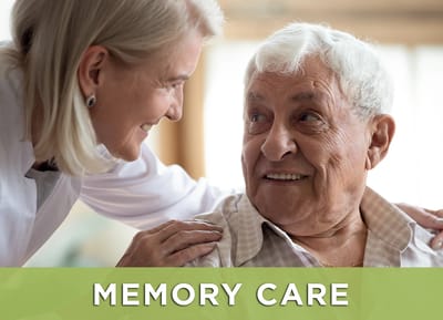 Care staff interacting with a resident in a warm setting