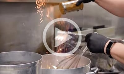 Heartis Longview Assisted Living, memory care in Longview, TX — Chef preparing a meal in a kitchen setting