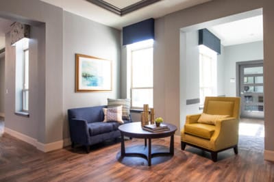 Bright common area with comfortable seating and decor.