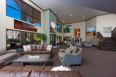 Bright and spacious common area with seating and art