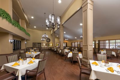 Bright dining room with nicely set tables