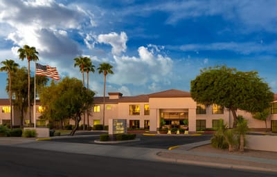 Exterior view of the Desert Winds Assisted Living facility at dusk