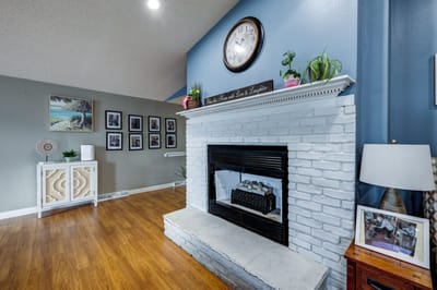 Bright interior of a cozy living area with a fireplace