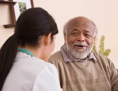 Staff member talking with a resident
