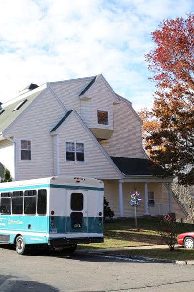 Exterior view of the HarborChase building and transportation van