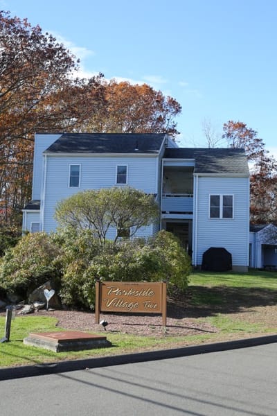 Exterior view of Parkside Village facility with sign