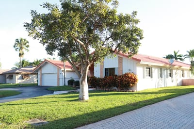 Exterior view of a residential care facility with landscaping