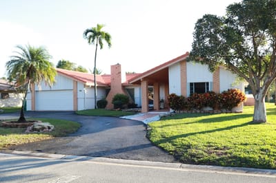 Exterior view of a residential style building with landscaping