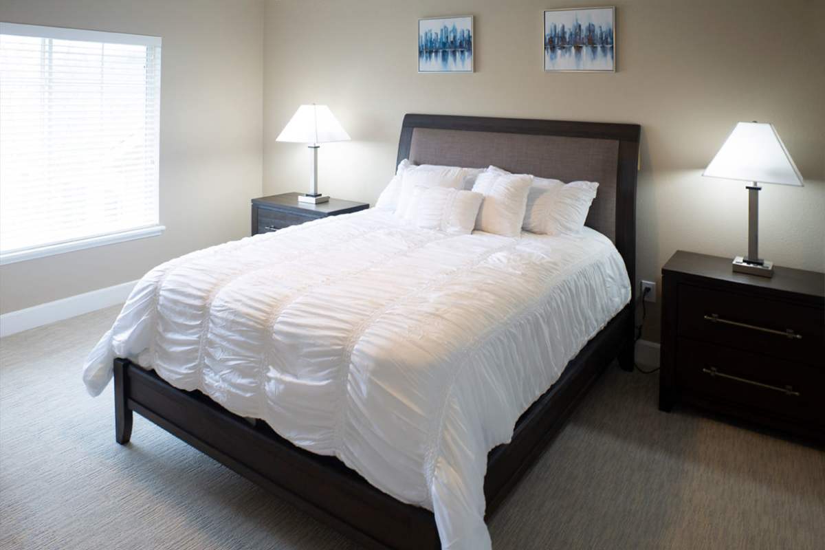 Cozy bedroom with a large bed and lamps