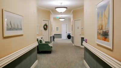 Interior hallway adorned with art and lighting